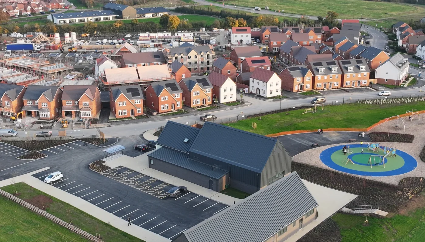 Image of lots of new builds with a park in the foreground